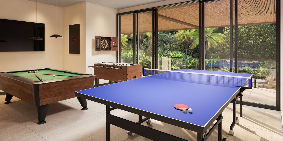 Sala de jogos do Vista do Vale, com mesa de sinuca e pebolim